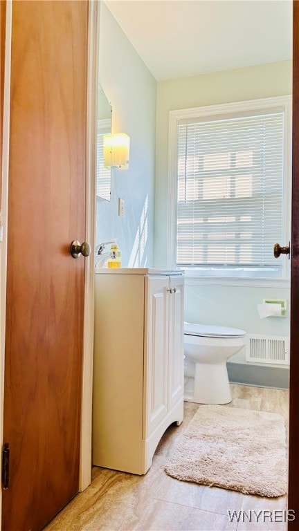 bathroom featuring tile patterned flooring and toilet