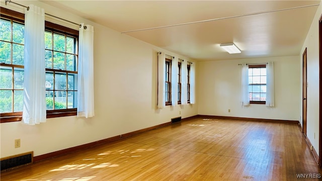 spare room with light hardwood / wood-style flooring