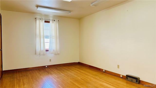 spare room featuring light wood-type flooring