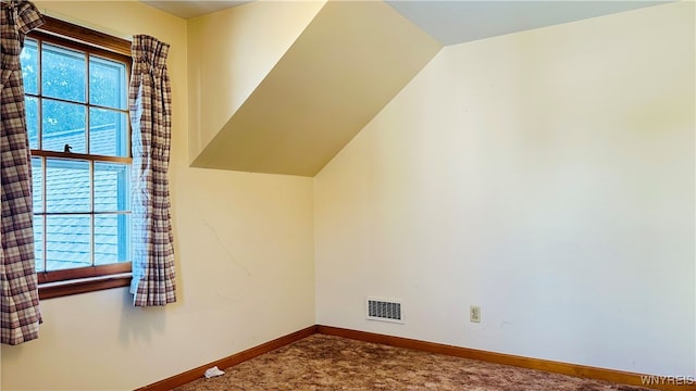 bonus room featuring lofted ceiling