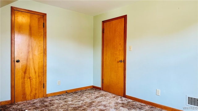 unfurnished room with carpet