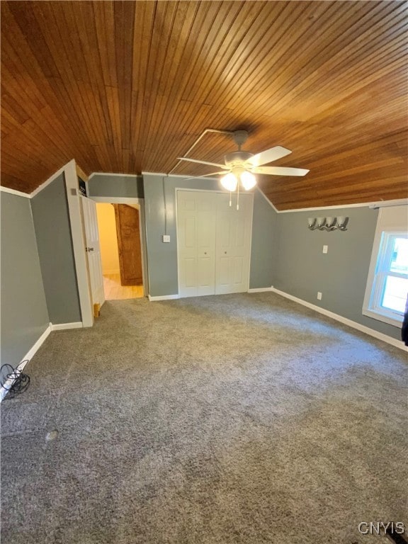 interior space featuring wood ceiling, ceiling fan, and vaulted ceiling