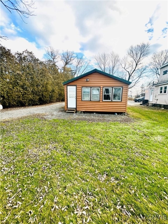 view of home's exterior featuring a yard