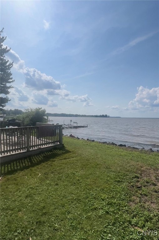 exterior space featuring a water view and a yard