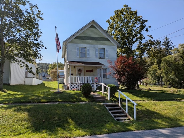 view of front facade with a front lawn and covered porch