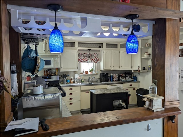 kitchen featuring stainless steel electric stove, butcher block counters, sink, and white cabinets