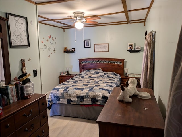 bedroom featuring ceiling fan, coffered ceiling, and light hardwood / wood-style floors