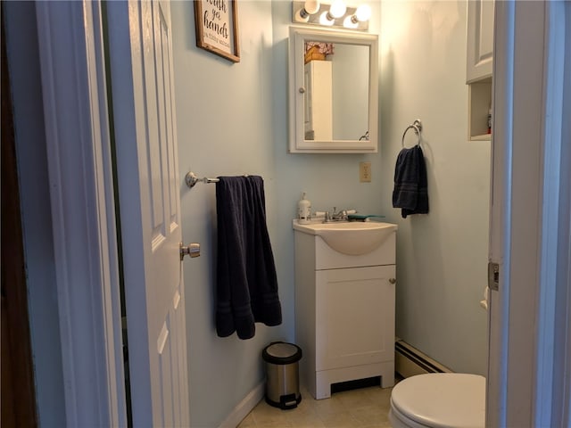 bathroom with vanity, toilet, a baseboard radiator, and tile patterned flooring