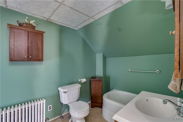 bathroom with tile patterned floors, toilet, sink, a bath, and radiator heating unit