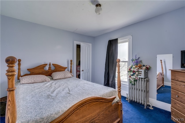 carpeted bedroom featuring radiator