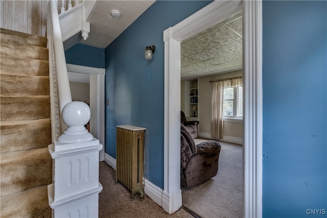 hallway featuring carpet