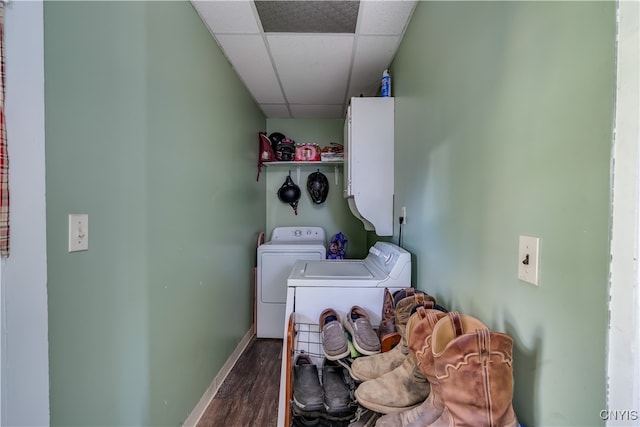 clothes washing area featuring separate washer and dryer and dark hardwood / wood-style flooring