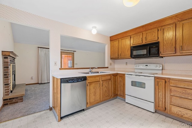 kitchen with backsplash, a brick fireplace, white range with electric cooktop, sink, and stainless steel dishwasher