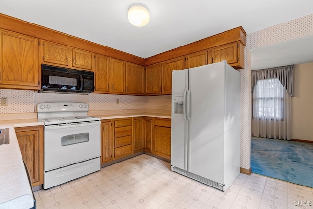 kitchen with white appliances and backsplash