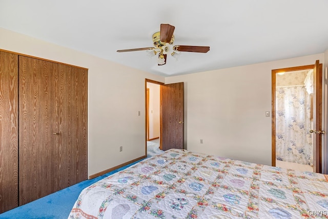 carpeted bedroom with ensuite bathroom, ceiling fan, and a closet