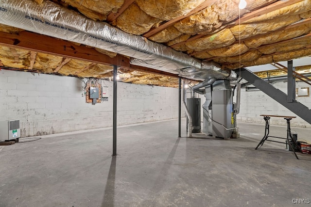 basement with gas water heater and heating unit