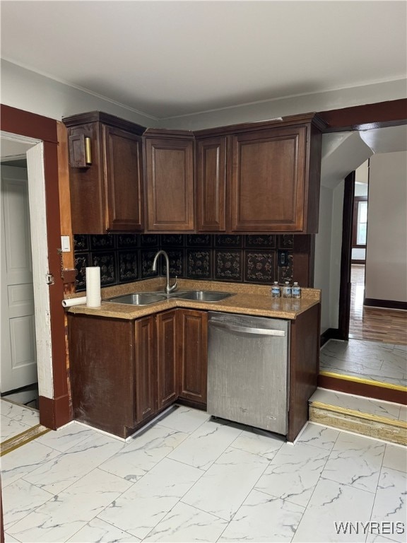 kitchen with dishwasher, decorative backsplash, dark brown cabinetry, and sink