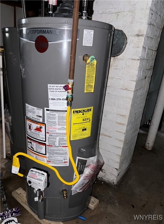 utility room featuring gas water heater