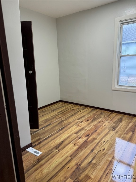 unfurnished room featuring wood-type flooring