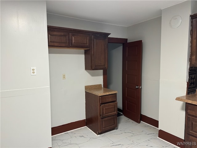 kitchen featuring dark brown cabinets