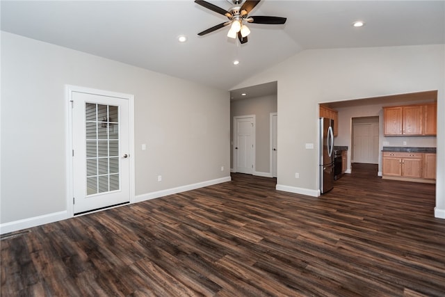 unfurnished living room with lofted ceiling, ceiling fan, and dark hardwood / wood-style flooring