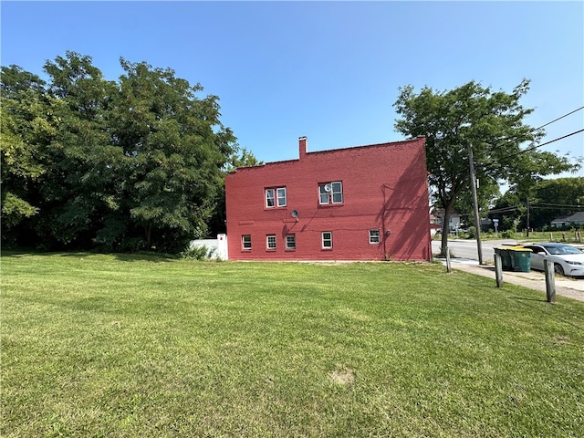 back of house with a yard