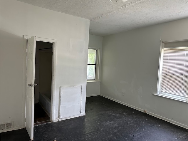 unfurnished bedroom featuring a textured ceiling