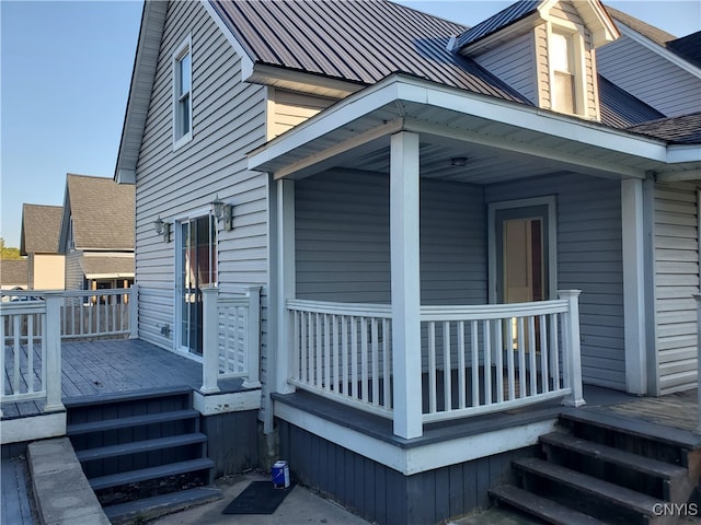 view of property exterior with a wooden deck