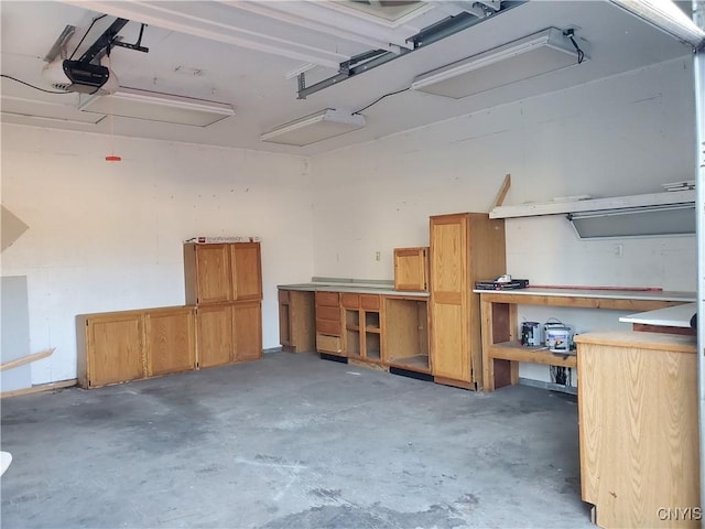 205 S James St, Wilna, NY 13619 - garage featuring a workshop area and a garage door opener
