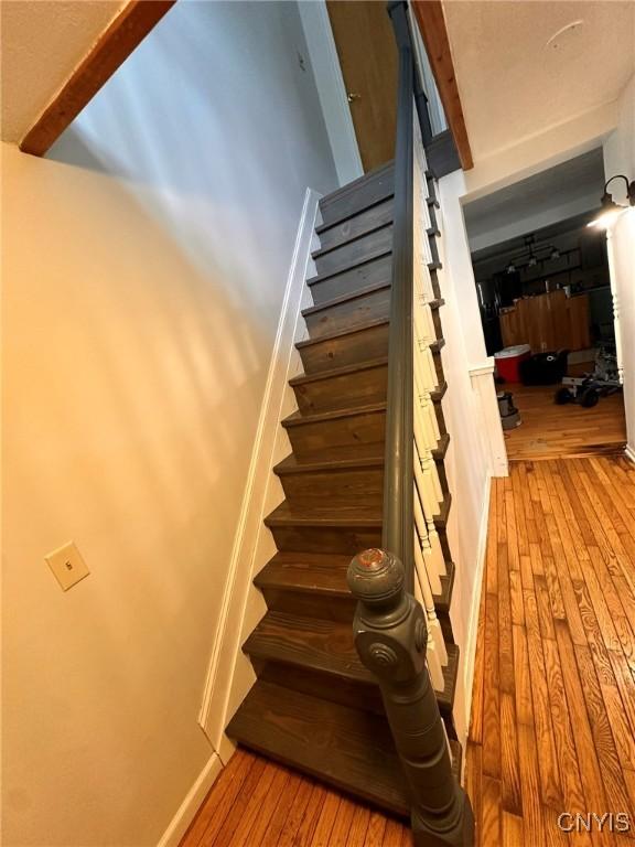 205 S James St, Wilna, NY 13619 - staircase with hardwood / wood-style flooring