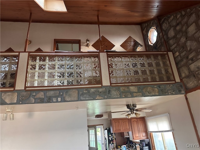 room details featuring ceiling fan and wood ceiling