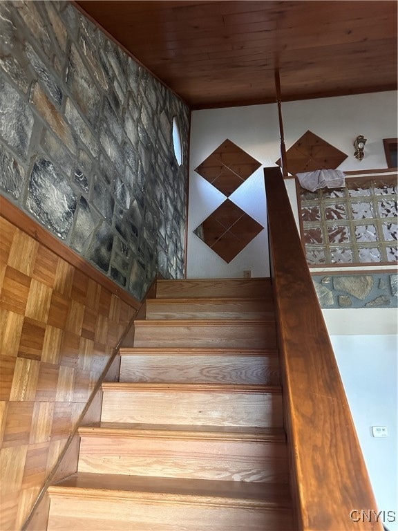 stairs featuring wood ceiling