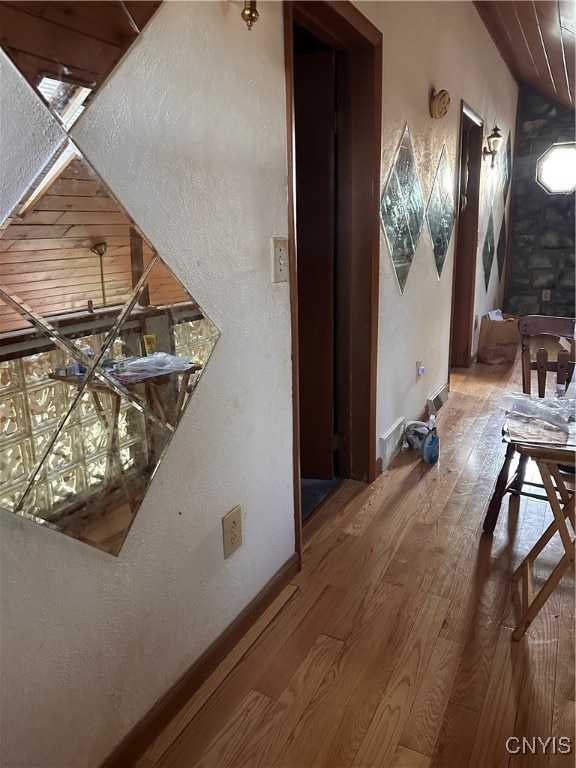 corridor featuring hardwood / wood-style floors