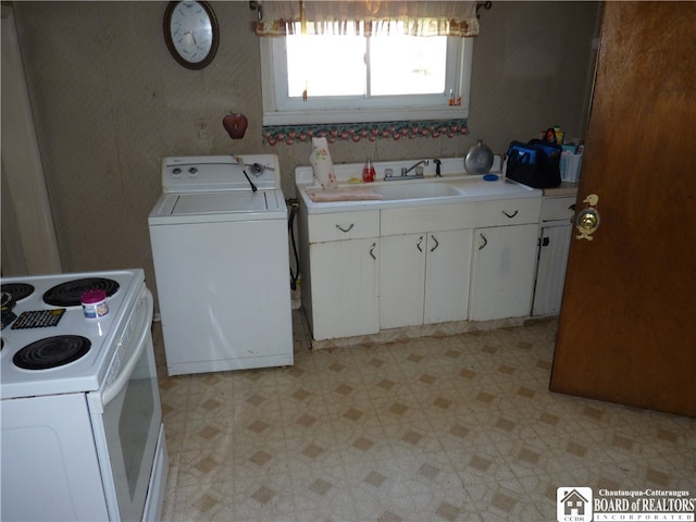 kitchen with washer / dryer, electric range, sink, and white cabinetry