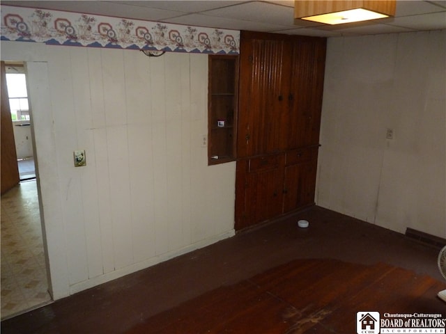 unfurnished room featuring a paneled ceiling