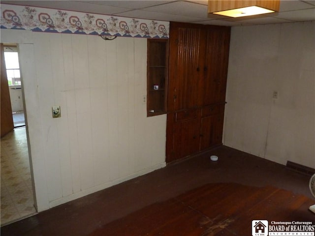 132 Miller St, Sherman, NY 14781 - spare room with wood finished floors and a paneled ceiling