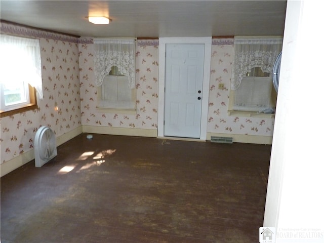 spare room with dark hardwood / wood-style flooring