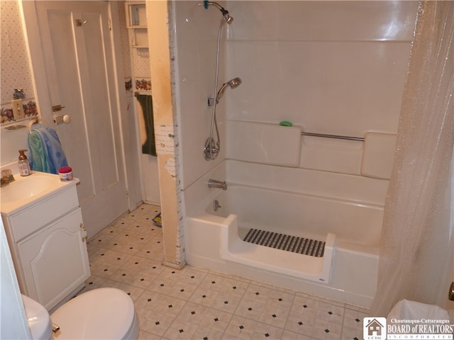 full bathroom with shower / bath combo, toilet, and vanity