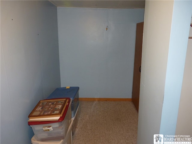 hallway featuring carpet flooring