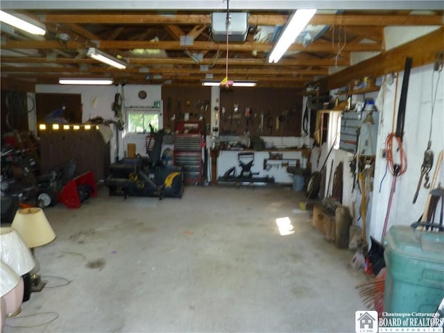 132 Miller St, Sherman, NY 14781 - garage featuring a garage door opener and a workshop area