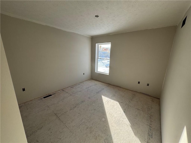 empty room with a textured ceiling