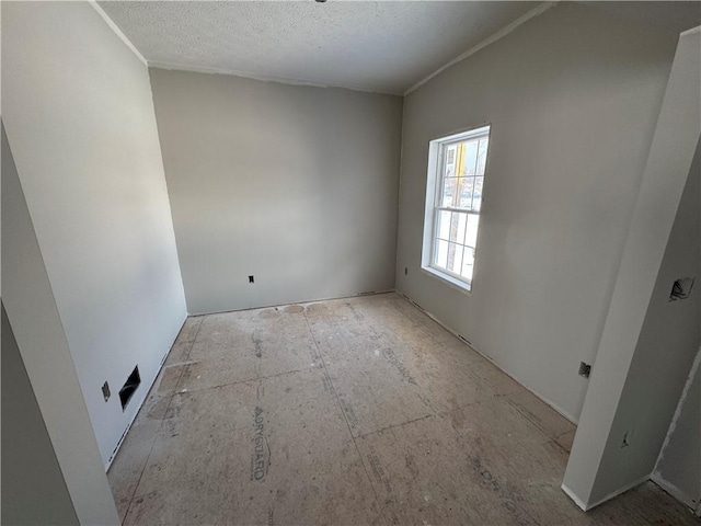 spare room featuring a textured ceiling