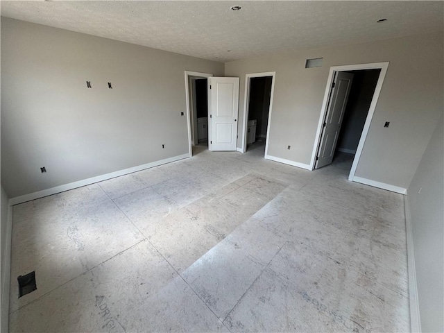36 Kaye Park Ter, Gates, NY 14624 - unfurnished bedroom featuring a textured ceiling and a spacious closet