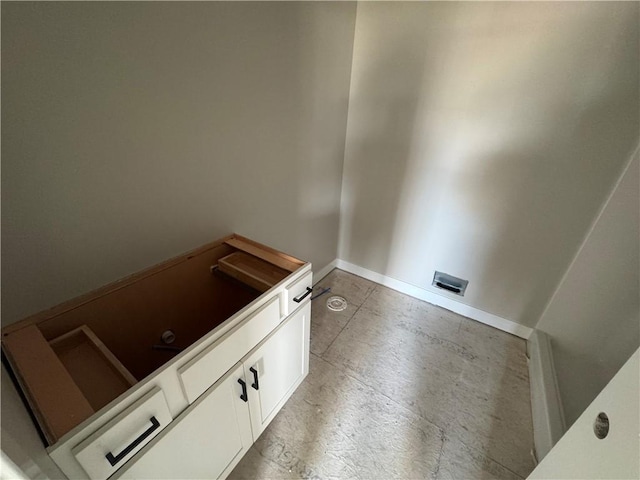 bathroom with baseboards and concrete floors
