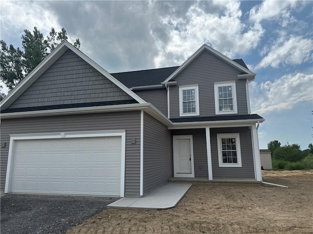 36 Kaye Park Ter, Gates, NY 14624 - traditional-style house with a garage, asphalt driveway, and covered porch