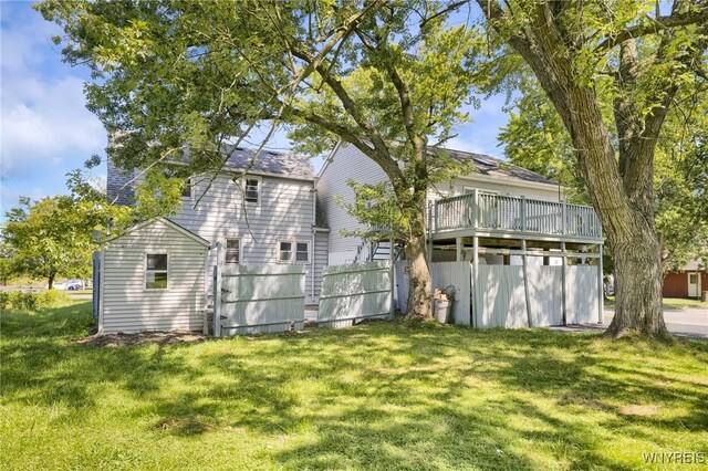 rear view of property with a lawn