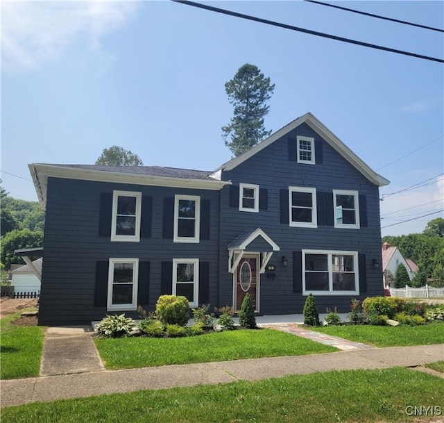 view of front of property with a front lawn