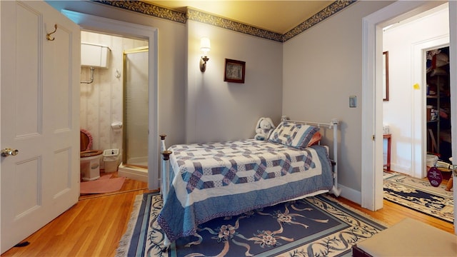 bedroom with light hardwood / wood-style flooring