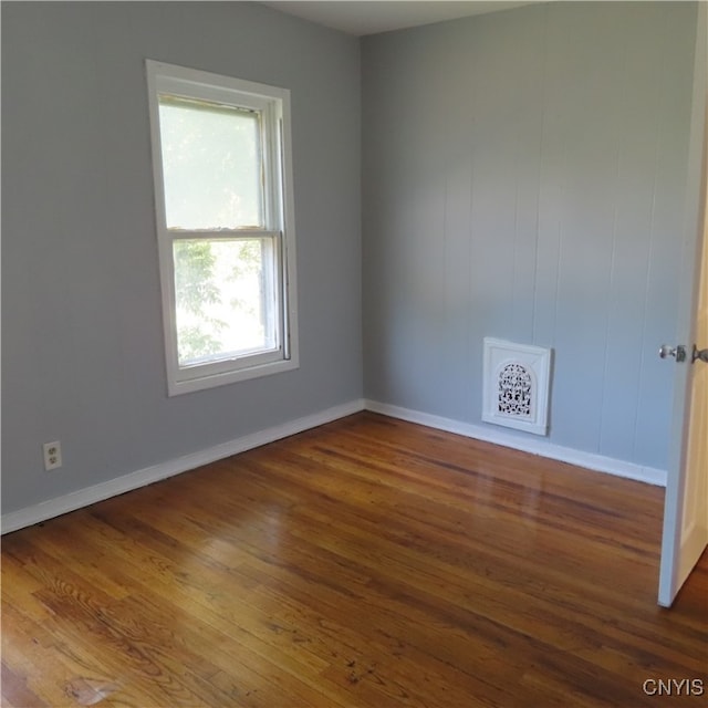 unfurnished room featuring hardwood / wood-style floors