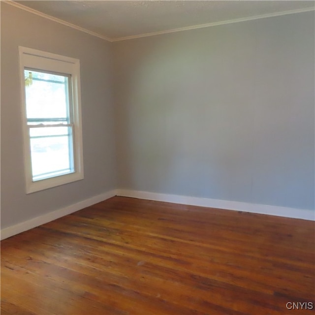 unfurnished room with ornamental molding, hardwood / wood-style flooring, and a wealth of natural light